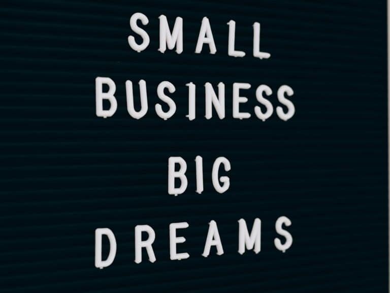 Close-up of a motivational quote about small business dreams on a letter board.